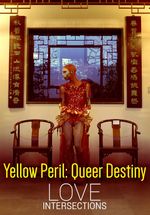 The drag artist Maiden China stands between two chairs looking to the right. Behind them is a window with Chinese-style lattice work, and banners with Chinese Characters. Maiden China wears heavy white face-makeup, a sequinned bodysuit, and has a shaved head.